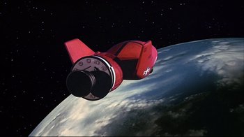 Movie still from “Marooned” (1969), directed by John Sturges – An image of a space ship flying in the sky; Extreme Wide shot, High angle