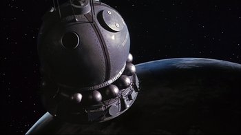 Movie still from “Marooned” (1969), directed by John Sturges – An image of a space ship in the dark; Extreme Wide shot, Low angle