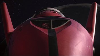 Movie still from “Marooned” (1969), directed by John Sturges – Looking up at the top portion of an airplane at night; Extreme Wide shot, Overhead angle