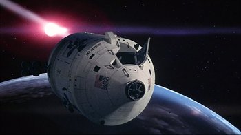 Movie still from “Marooned” (1969), directed by John Sturges – An image of a space ship in the space; Extreme Wide shot, Overhead angle