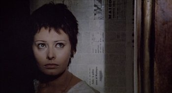 Movie still from “Marriage Italian Style” (1964), directed by Vittorio De Sica – A person with short black hair; Close Up shot, Over the shoulder angle
