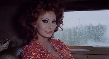 Movie still from “Marriage Italian Style” (1964), directed by Vittorio De Sica – A woman in a red and blue floral dress; Close Up shot, Low angle