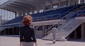 Movie still from “Marriage Italian Style” (1964), directed by Vittorio De Sica – A man and a woman walking down a flight of stairs; Extreme Wide shot, Low angle