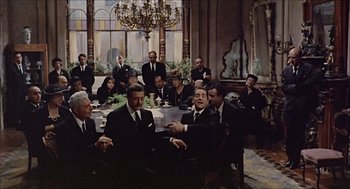 Movie still from “Marriage Italian Style” (1964), directed by Vittorio De Sica – A group of men sitting at a table in a room; Wide shot, High angle