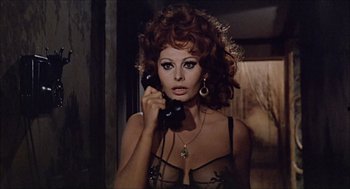 Movie still from “Marriage Italian Style” (1964), directed by Vittorio De Sica – A woman in lingerie holding a phone up to her ear; Close Up shot, Low angle