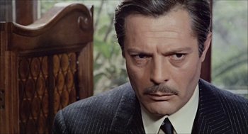 Movie still from “Marriage Italian Style” (1964), directed by Vittorio De Sica – A man that is wearing a suit and tie; Close Up shot, Low angle