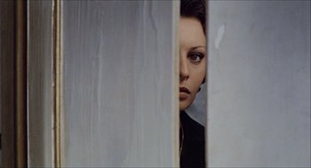 Movie still from “Marriage Italian Style” (1964), directed by Vittorio De Sica – A person standing behind a wall; Close Up shot, Over the shoulder angle