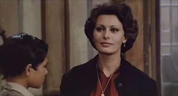 Movie still from “Marriage Italian Style” (1964), directed by Vittorio De Sica – A person wearing a suit and tie; Close Up shot, Over the shoulder angle