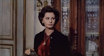 Movie still from “Marriage Italian Style” (1964), directed by Vittorio De Sica – A person wearing a suit and tie; Medium shot, Over the shoulder angle