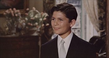 Movie still from “Marriage Italian Style” (1964), directed by Vittorio De Sica – A young man in a suit and tie; Close Up shot, High angle