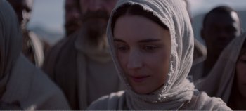 Movie still from “Mary Magdalene” (2018), directed by Garth Davis – A person wearing a hood; Close Up shot, Over the shoulder angle