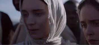 Movie still from “Mary Magdalene” (2018), directed by Garth Davis – A person wearing a head scarf; Close Up shot, Over the shoulder angle