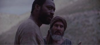 Movie still from “Mary Magdalene” (2018), directed by Garth Davis – Two men standing next to each other on a hill; Close Up shot, Over the shoulder angle