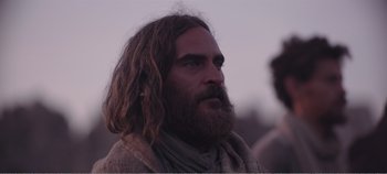 Movie still from “Mary Magdalene” (2018), directed by Garth Davis – A man with long hair and a long beard; Close Up shot, Over the shoulder angle