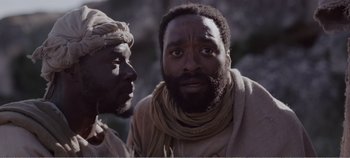 Movie still from “Mary Magdalene” (2018), directed by Garth Davis – A man with a beard is talking to another man; Close Up shot, Low angle