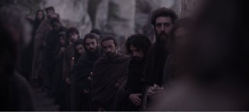 Movie still from “Mary Magdalene” (2018), directed by Garth Davis – A group of men standing next to each other; Medium shot, Over the shoulder angle