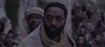 Movie still from “Mary Magdalene” (2018), directed by Garth Davis – A man with a beard is standing next to another man with a beard; Close Up shot, Over the shoulder angle