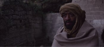 Movie still from “Mary Magdalene” (2018), directed by Garth Davis – A man with a beard wearing a turban; Close Up shot, Over the shoulder angle