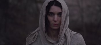 Movie still from “Mary Magdalene” (2018), directed by Garth Davis – A woman with a hood over her head; Close Up shot, Low angle