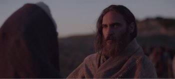 Movie still from “Mary Magdalene” (2018), directed by Garth Davis – A man with long hair and a long beard; Close Up shot, Over the shoulder angle