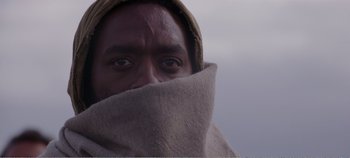 Movie still from “Mary Magdalene” (2018), directed by Garth Davis – A man covering his face with a blanket; Extreme Close Up shot, Low angle