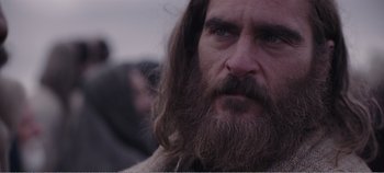 Movie still from “Mary Magdalene” (2018), directed by Garth Davis – A person with long hair and a beard; Close Up shot, Over the shoulder angle