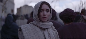 Movie still from “Mary Magdalene” (2018), directed by Garth Davis – A woman with a scarf around her neck; Close Up shot, Low angle