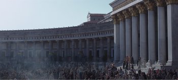 Movie still from “Mary Magdalene” (2018), directed by Garth Davis – A crowd of people gathered in front of a large building; Extreme Wide shot, Low angle