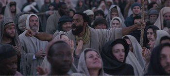 Movie still from “Mary Magdalene” (2018), directed by Garth Davis – A group of people gathered together in a crowd; Medium shot, Low angle