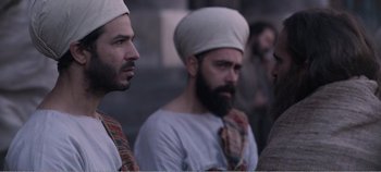 Movie still from “Mary Magdalene” (2018), directed by Garth Davis – A group of men standing next to each other; Medium shot, Over the shoulder angle