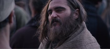 Movie still from “Mary Magdalene” (2018), directed by Garth Davis – A man with long hair and a long beard; Close Up shot, Over the shoulder angle