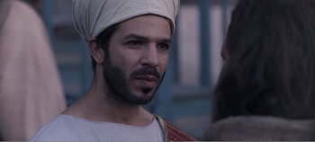 Movie still from “Mary Magdalene” (2018), directed by Garth Davis – A man with a beard wearing a white turban; Close Up shot, Over the shoulder angle