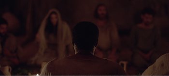 Movie still from “Mary Magdalene” (2018), directed by Garth Davis – A man in a brown shirt and two men in brown robes; Wide shot, Over the shoulder angle