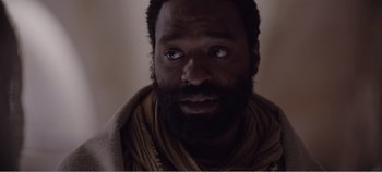 Movie still from “Mary Magdalene” (2018), directed by Garth Davis – A man with a beard is looking into the camera; Close Up shot, Over the shoulder angle