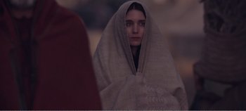 Movie still from “Mary Magdalene” (2018), directed by Garth Davis – A woman wrapped in a blanket looking into the distance; Close Up shot, Over the shoulder angle