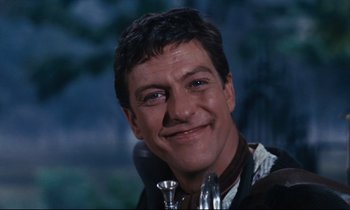 Movie still from “Mary Poppins” (1964), directed by Robert Stevenson – A person with a microphone; Close Up shot, Low angle