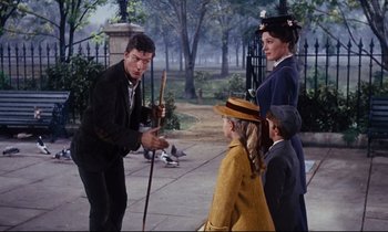 Movie still from “Mary Poppins” (1964), directed by Robert Stevenson – A group of people standing next to each other on a sidewalk; Medium shot, High angle