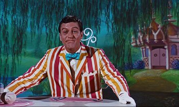 Movie still from “Mary Poppins” (1964), directed by Robert Stevenson – A wax statue of a man in a striped suit; Medium shot, Low angle