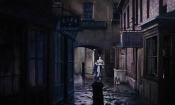 Movie still from “Mary Poppins” (1964), directed by Robert Stevenson – A woman walking down a street with a dog in the rain; Wide shot, High angle