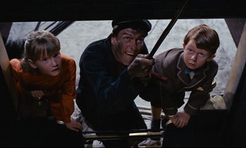 Movie still from “Mary Poppins” (1964), directed by Robert Stevenson – A group of young people standing next to each other; Medium shot, Overhead angle