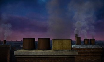 Movie still from “Mary Poppins” (1964), directed by Robert Stevenson – A bunch of smoke coming out of a chimney on top of a building; Extreme Wide shot, Low angle