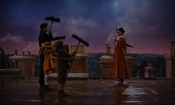 Movie still from “Mary Poppins” (1964), directed by Robert Stevenson – A group of people on a stage holding brooms; Wide shot, Low angle