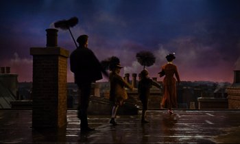 Movie still from “Mary Poppins” (1964), directed by Robert Stevenson – A group of people standing next to each other on top of a building; Wide shot, Low angle