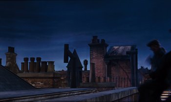 Movie still from “Mary Poppins” (1964), directed by Robert Stevenson – A view of a building from across the street; Extreme Wide shot, Low angle