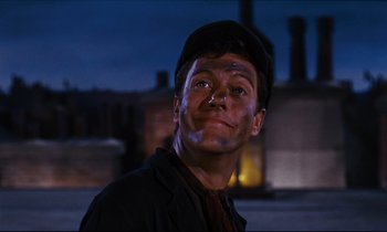 Movie still from “Mary Poppins” (1964), directed by Robert Stevenson – A man with a hat on looking at the camera; Close Up shot, Low angle