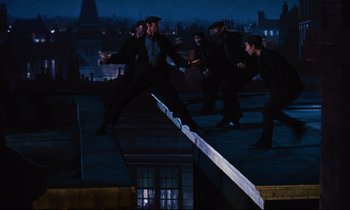 Movie still from “Mary Poppins” (1964), directed by Robert Stevenson – A group of men on a rooftop at night; Wide shot, Low angle