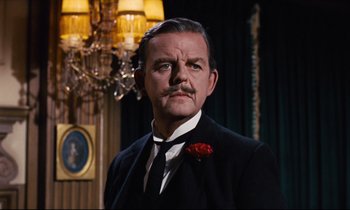 Movie still from “Mary Poppins” (1964), directed by Robert Stevenson – A person wearing a suit and tie; Close Up shot, Low angle