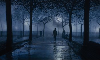Movie still from “Mary Poppins” (1964), directed by Robert Stevenson – A man walking down the street at night in the fog; Wide shot, Low angle