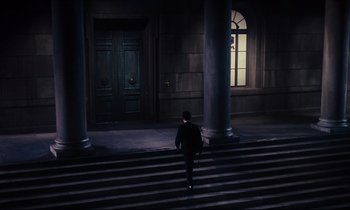 Movie still from “Mary Poppins” (1964), directed by Robert Stevenson – A man walking down the stairs of a building at night; Extreme Wide shot, High angle