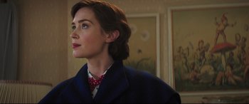 Movie still from “Mary Poppins Returns” (2018), directed by Rob Marshall – A woman in a blue jacket and a red bow tie; Close Up shot, Over the shoulder angle